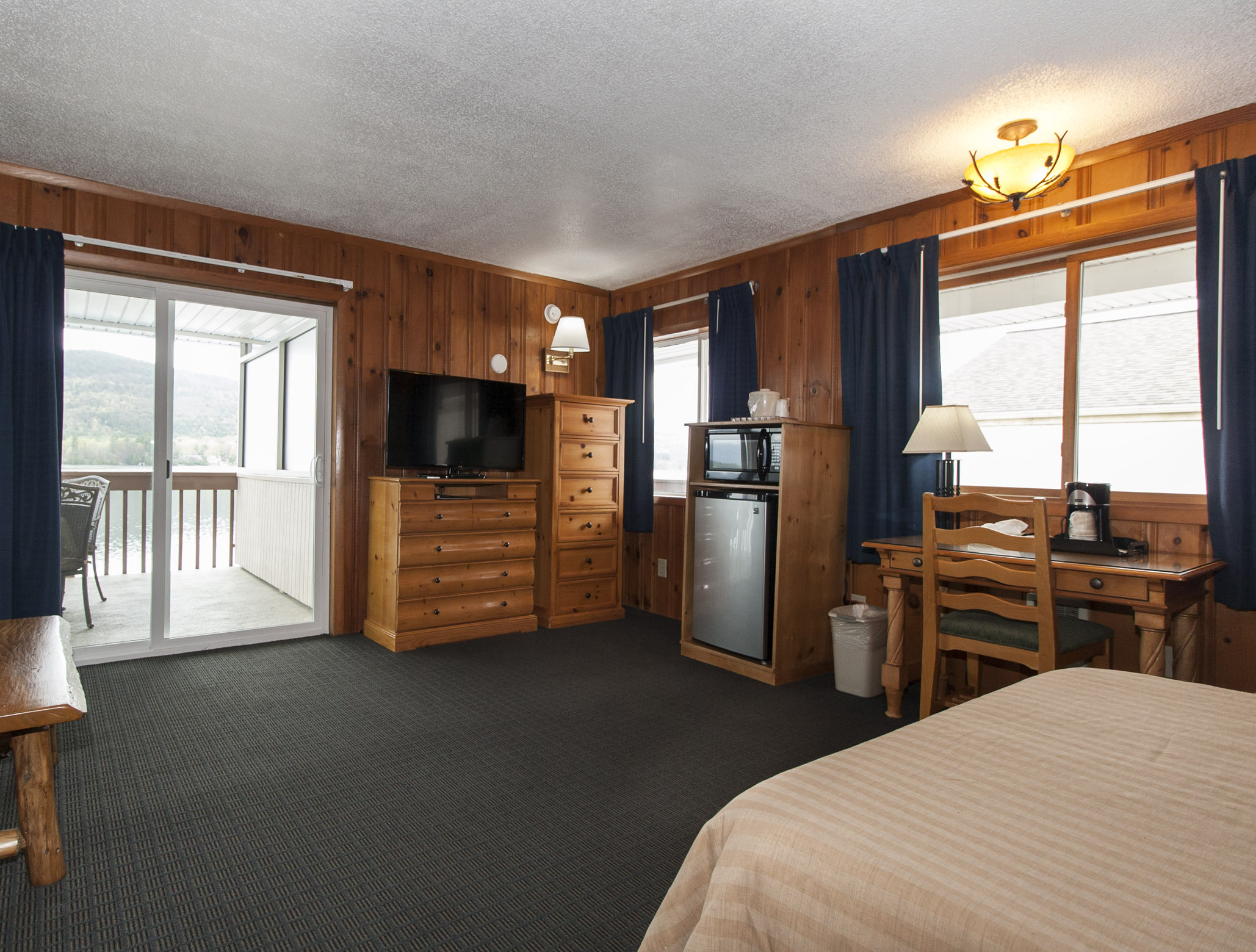 Lake Motel Room with sliding glass door to balcony